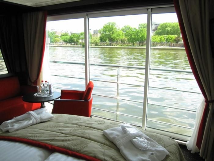 LayinginbedofAvalonFrenchbalconyroom