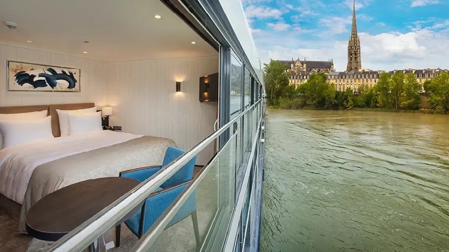Avalon Waterways Suite Ship cruising a European river at night