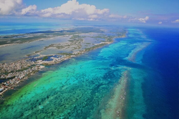 Aerial view of a Caribbean reef and turquoise water on a Crystal Cruises itinerary