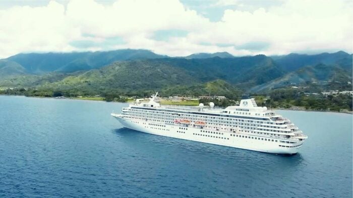 Crystal Cruises ultra-luxury ship anchored in a tropical bay