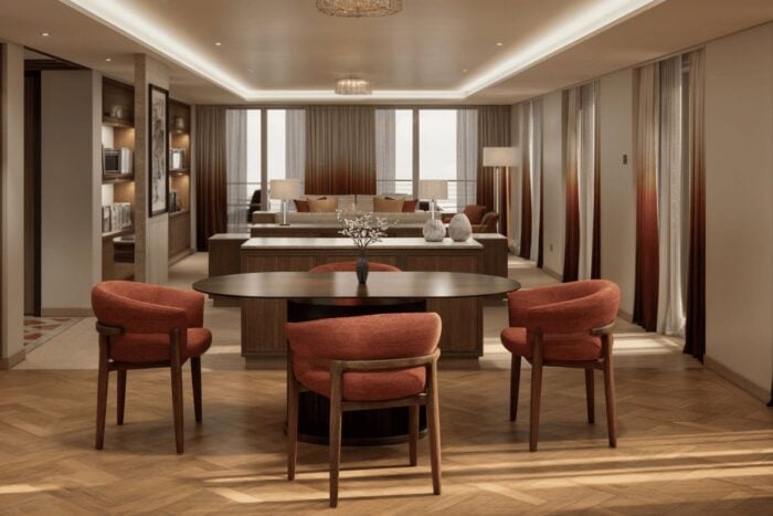Penthouse Panorama Suite aboard Crystal Grace with dining table and floor-to-ceiling windows