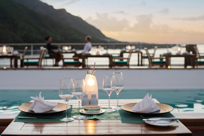 Le Grill poolside restaurant aboard the m/s Paul Gauguin at sunset