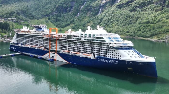 Celebrity Apex cruise ship docked in the Geiranger fjord, Norway — military and veteran discount available through Military Cruise Deals