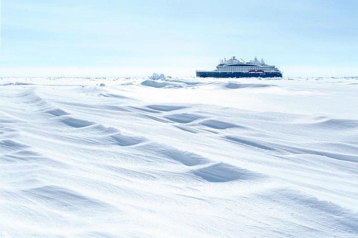 PONANT's Le Commandant Charcot icebreaker surrounded by white polar sea ice