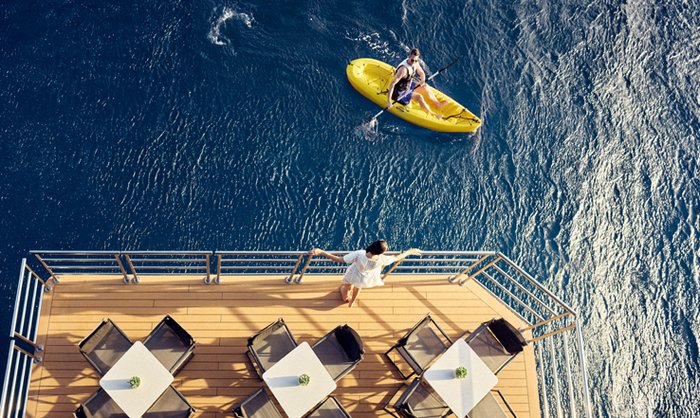 Guest kayaking from the Marina of a Ritz-Carlton yacht
