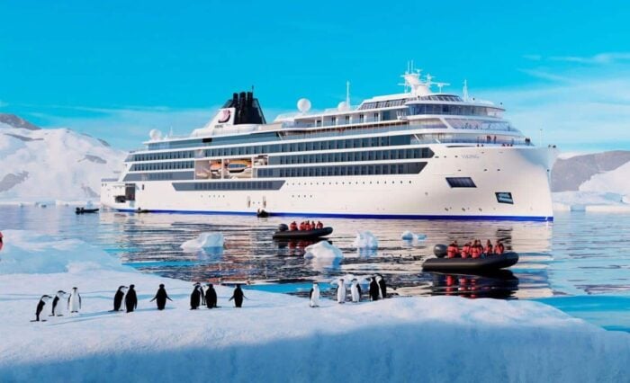 Viking expedition ship in Antarctica with Zodiacs and penguins