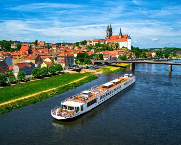 Viking Longship on the Elbe River below Meissen Cathedral and Albrechtsburg Castle in Germany